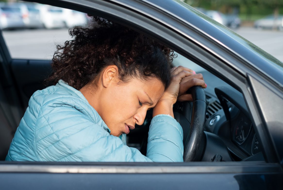 Frustrated Woman Stuck In Traffic Jam