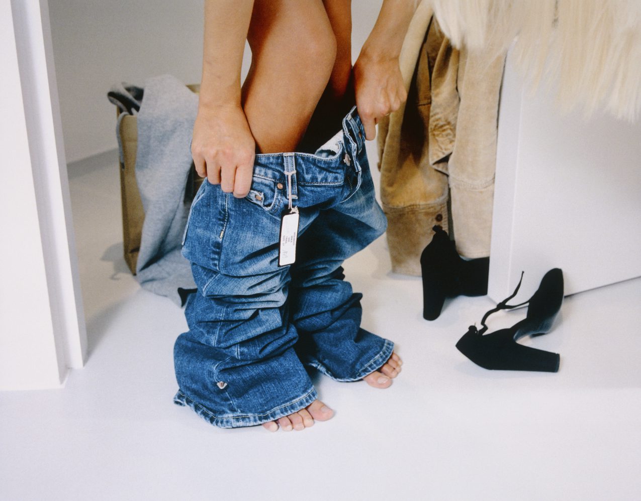 Woman Trying On Jeans