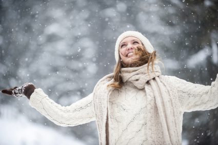 Young Woman Having Fun In Snow