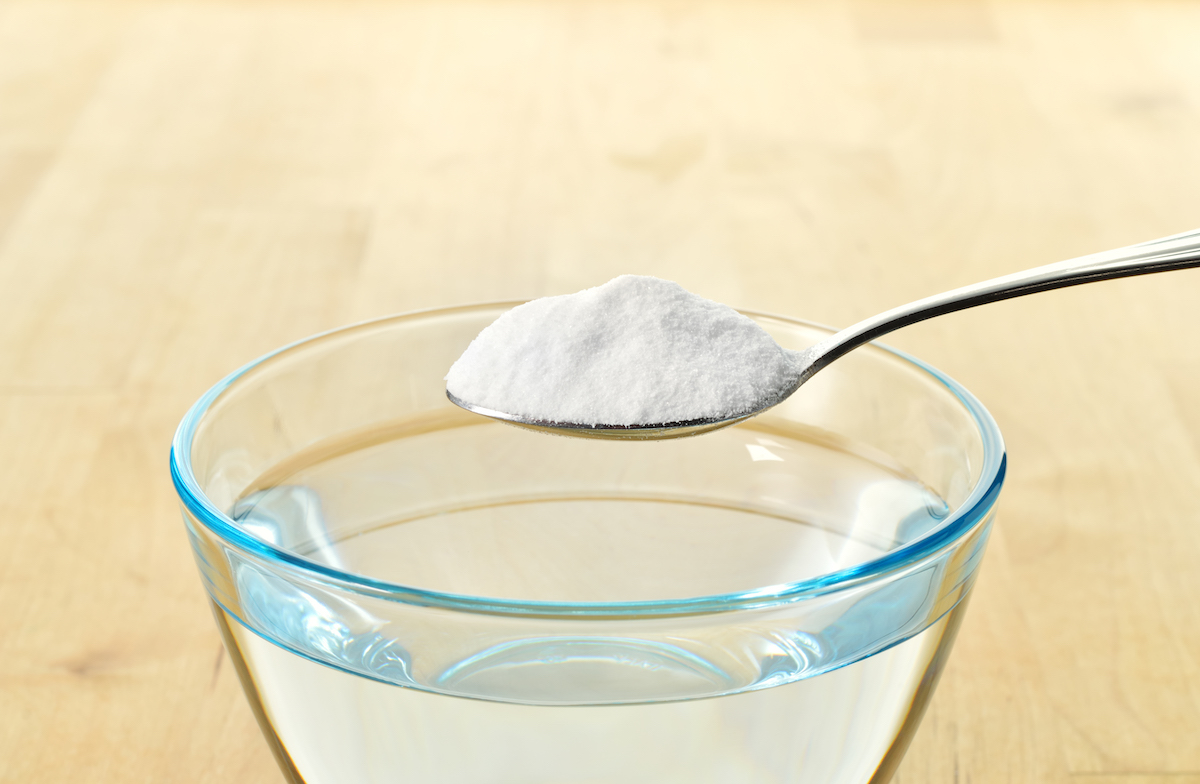 Close Up Of Baking Soda On Spoon.